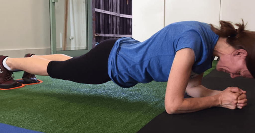 Planking exercise, woman planking, getting expert strength coaching, Strength training for women Melbourne - Run Ready