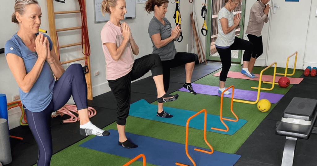 Women exercising in gym, group strength training, Strength and conditioning coach for women - Run Ready