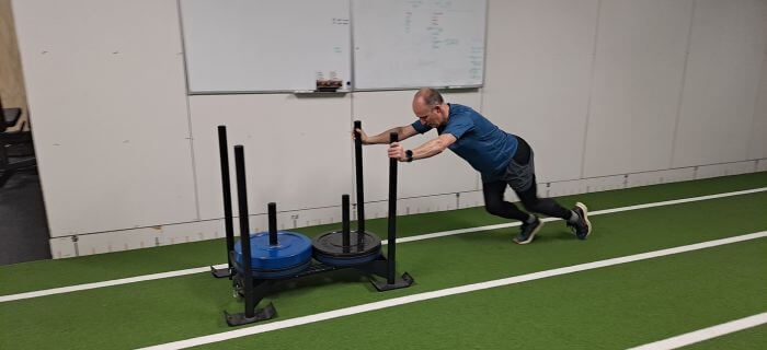 training with a sled, sled training, sled training in the gym, training for runners, trail running coach, private running coach